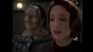 DS9 Garak inspects a plasma rifle