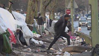 Thousands of asylum seekers waiting in streets makeshift camps around Paris