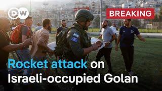 Ten people killed as rocket hits football pitch in Israeli-occupied Golan  DW News