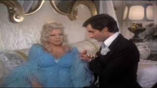 Mae West & Timothy Dalton sing Love Will Keep Us Together