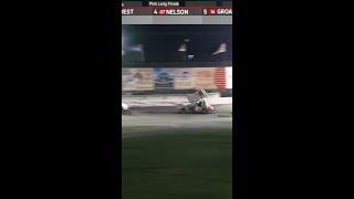 Sprint car goes airborne and gets hangs from catch fence #nascarroots