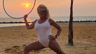 Sunrise Stretching with the hula hoop   Reba Fitness on the Beach