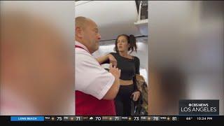 Passenger kicked off Delta flight after throwing bottle at flight attendant smashing onlookers pho
