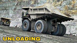 Unloading Hundreds of Tons of Cargo From Large Trucks at the Dump - Cat 797F & Cat 793F Haul Truck