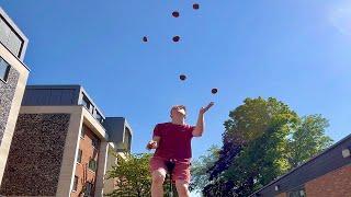 World Record for 7 Balls Juggled While Riding a Unicycle