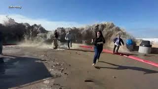 Rogue wave hits California flooding streets and sweeping people off their feet in Ventura