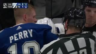 Michael Bunting and Corey Perry go at it