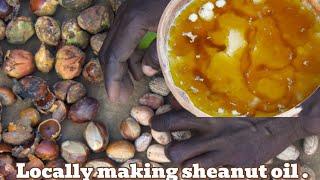 Typical village life in Africa making Sheanut oil using soil and ash with my mother