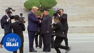Moment Trump steps into North Korea to meet Kim Jong-un