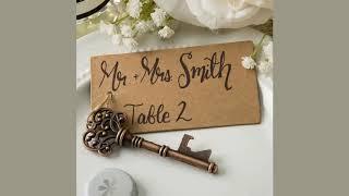 Copper skeleton key bottle opener with a kraft paper tag Name  Place Cards