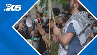 Protesters greet President Joe Biden upon his arrival in Seattle