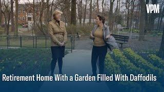 A unique retirement home in Arlington featuring a garden filled with daffodils