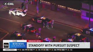 Stolen vehicles tire ripped off by spike strip during lengthy pursuit with armed suspect