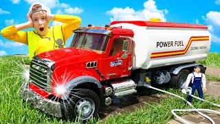 Toy cars for children. The BRUDER fuel truck came to the aid of a concrete mixer