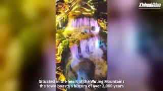 Stunning thunderous waterfall in ancient Chinese town