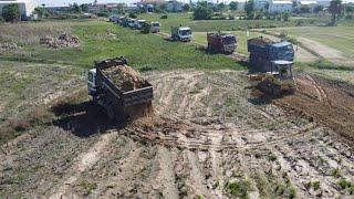 The huge landfill project 15 5T dump truck delivery soil & D20P bulldozer work so hard for project