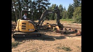 Splitting wood with the excavator