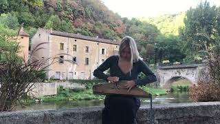 Latvian folk song “Ej laimiņa” played on Kokle in medieval town Burlats South France by Xenia Twarz