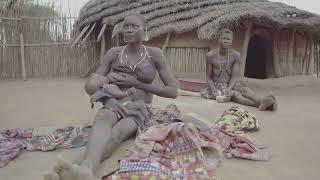 Larim tribe mother breastfeeding in a village Boya Mountains Imatong South Sudan