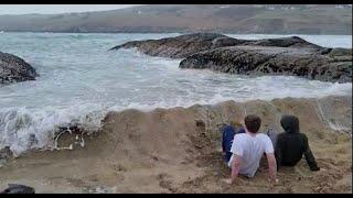 Ocean smashes kids dam built to stop the tide