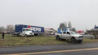 CUMMINS PULLS LOADED SEMI OUT OF FIELD