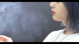 Beautiful smoking  girl a blowing smoke through her nose AMR voice