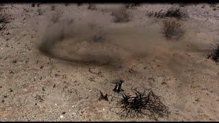 Walking into a small Dust devil in the almost windless Desert