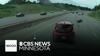 Dash cam footage shows close call between motorcyclist and dump truck