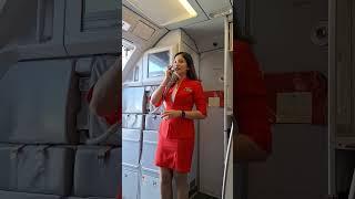 PRETTY AIR ASIA FLIGHT ATTENDANT CLOSES  DOOR AS PLANE GETS READY FOR TAKEOFF #airasia #planeride