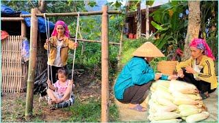 After harvesting corn to sell mother made a swing for her daughter and they played together.