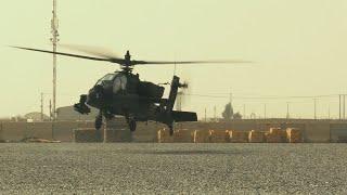 TF Marauder AH-64 Apache helicopters stop to refuel  color graded footage