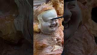 Detailing the Laughing Buddha Wood Sculpture