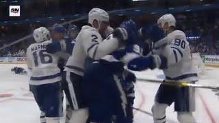 Morgan Reilly hits Brayden Point into the boards and Kucherov responds