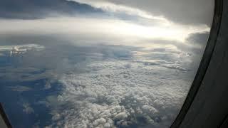 4K HD Airplane Window Seat View Sea of Clouds