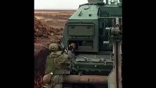 Russian Soldier loading the 2S19 MSTA 152.4mm SPGH self propelled howitzer