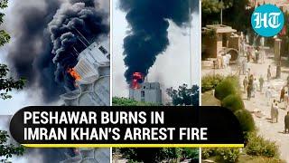 Peshawar On The Boil Imran Khan supporters steal weapons Burn Radio Pak building  Watch