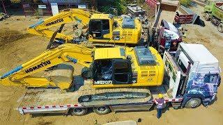 Komatsu PC210 Excavator Transport By Self Loader Trucks To The Construction site