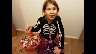 Delani tries different sweets that she got from halloween.