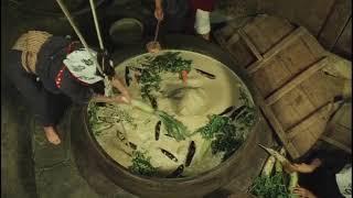 Woman soaked in large pot filled with creamy gunge