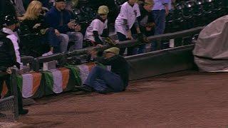 MIN@CWS Fan falls onto field after chasing foul