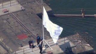 Mysterious white flags fly over Brooklyn Bridge