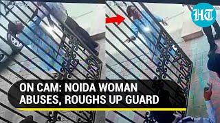 Viral Noida Woman hurls abuses slaps security guard over delay in opening gate