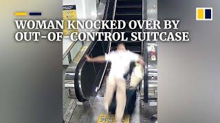 Woman knocked over by out-of-control suitcase left on escalator