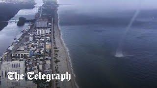 Waterspout crashes on to beach full of people in Miami Florida