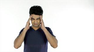 Attractive young guy suffering from a severe headache - health...  Indian Stock Footage  Knot9