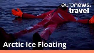 Arctic Ice Floating Would you brave a swim in a frozen lake in Lapland?