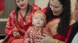 Nepali cultural rice feeding ceremony.