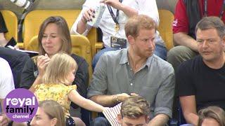 Sneaky toddler steals Prince Harrys popcorn