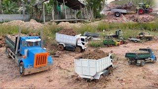 A group of trucks  transporting land stuck and tractors. Transporting heavy trees.Mega Rc Tractor…