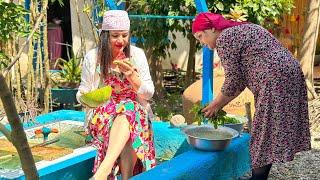 Cooking caviar and garlic leaves with olives in the traditional way in the village